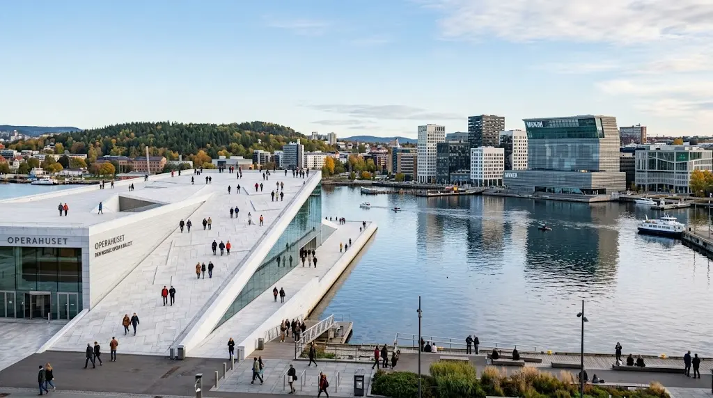 Oslo Opera House beside the waterfront with modern Oslo architecture and the Oslofjord